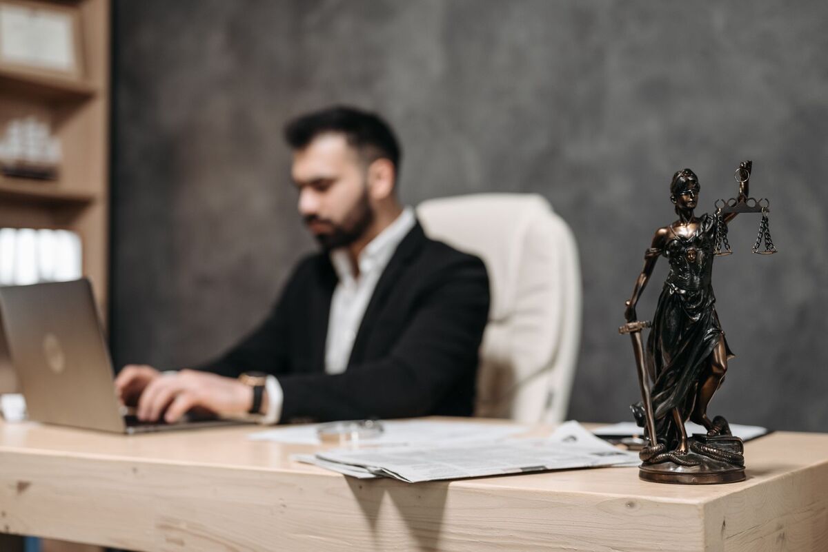 Attorney at a Denver law office with scales of justice